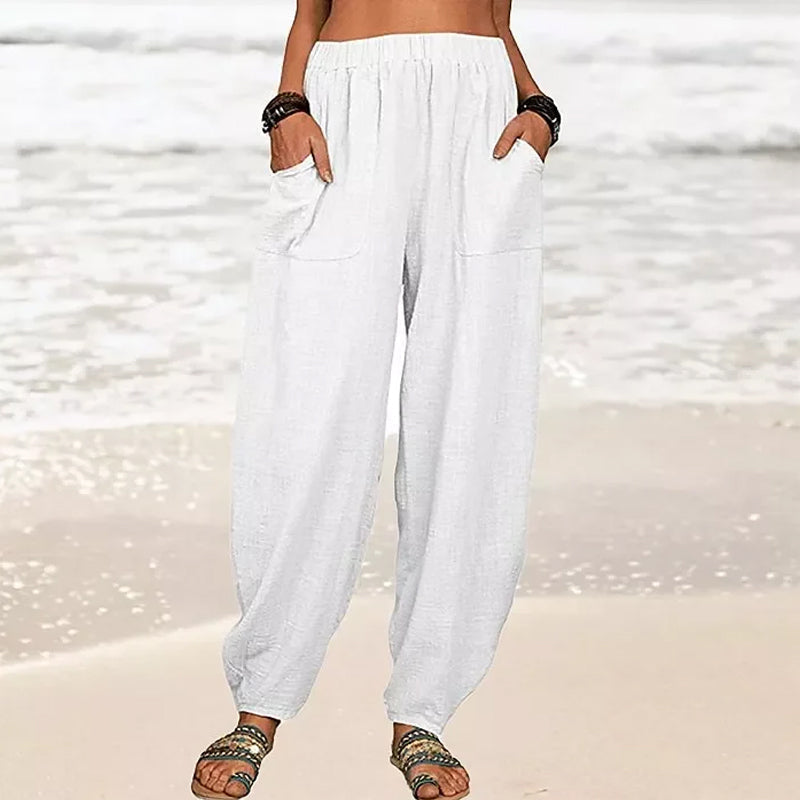 Relaxed wide-leg women's beach pants in a light, flowy fabric, perfect for summer casual wear & vacation.