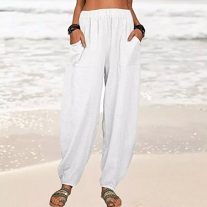 Relaxed wide-leg women's beach pants in a light, flowy fabric, perfect for summer casual wear & vacation.