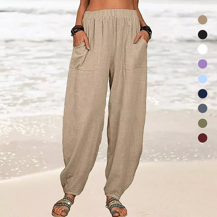 Lightweight & airy women's wide-leg beach pants flowing in the breeze, ideal for stylish summer vacation looks.