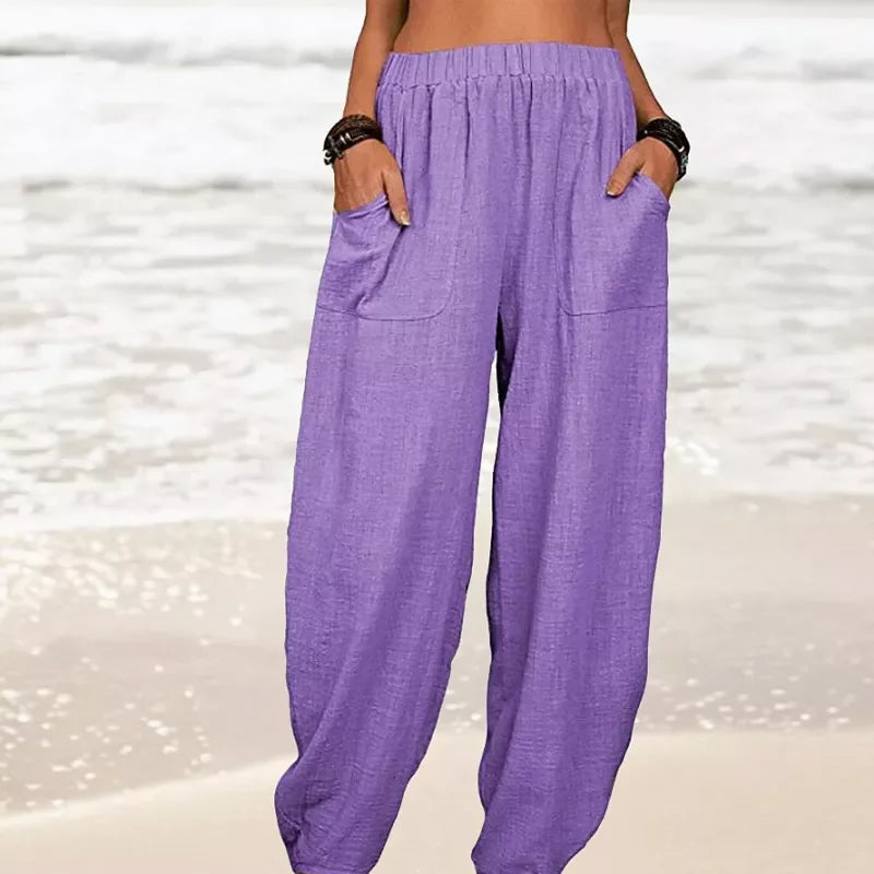 Flowy wide-leg summer beach pants for women, offering a loose, comfortable fit for vacation & resort style.