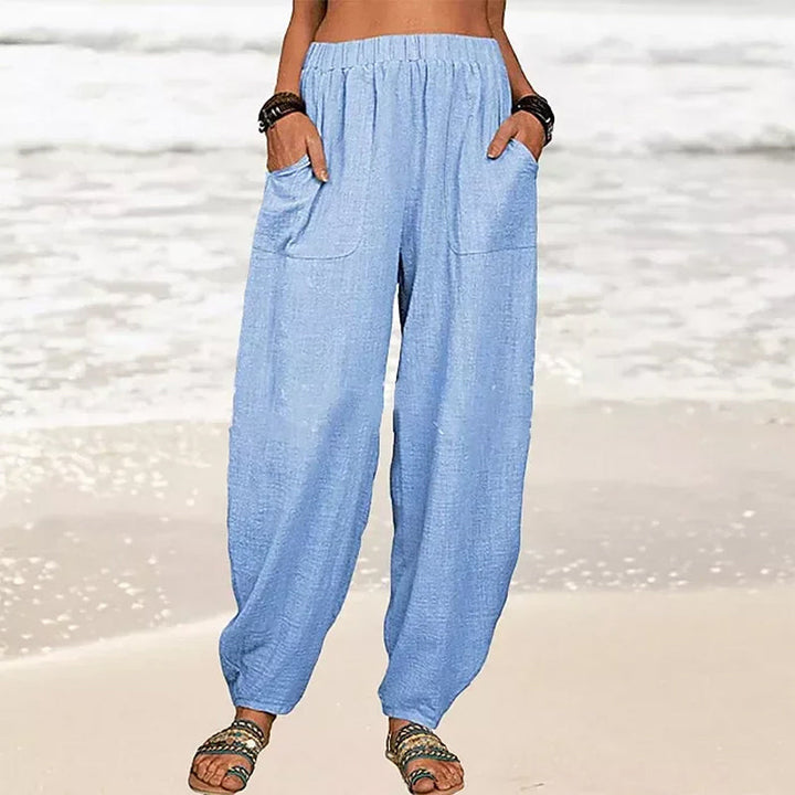 Women's wide-leg beach pants, versatile for summer outings, pair with sandals for effortless vacation style.