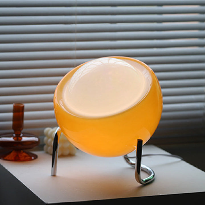 Clear glass orb table lamp with a retro Nordic design. Perfect modern accent lighting.