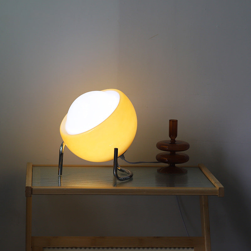 Elegant retro glass orb table lamp. Ideal for living room ambient lighting and home decor.