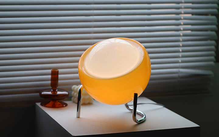 Ambient glass orb table lamp. Perfect for serene bedroom lighting and a Nordic touch.