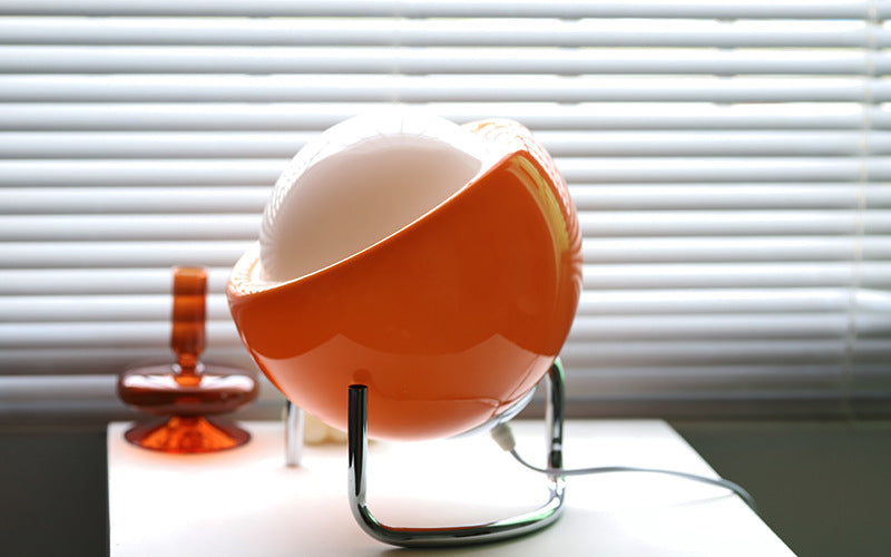 Unique retro glass orb table lamp. Features a minimalist Nordic aesthetic for modern homes.