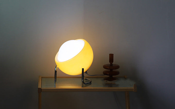 Close-up of an elegant retro glass orb table lamp, highlighting its Nordic design.