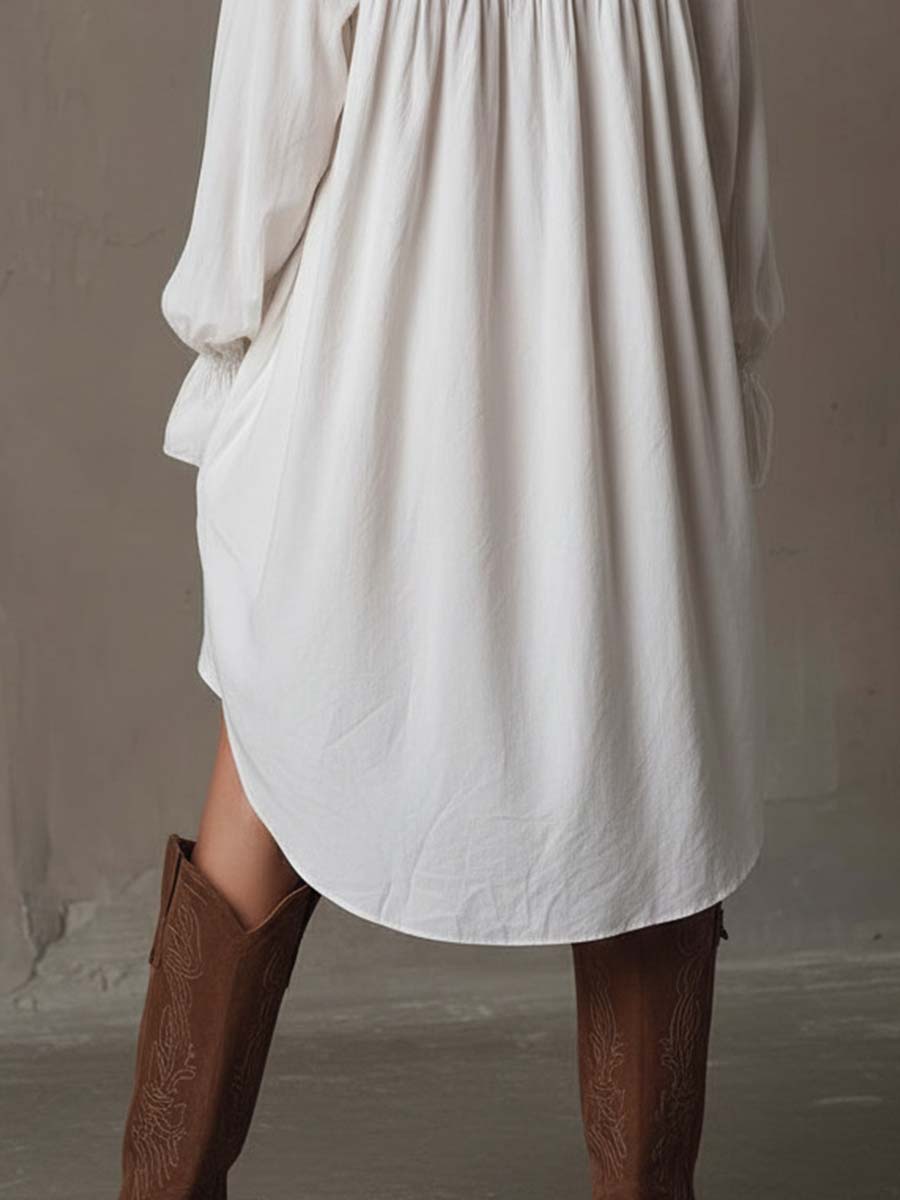 Elegant long-sleeve retro white mini dress for women, with a unique irregular hem. Ideal as a party or autumn dress.