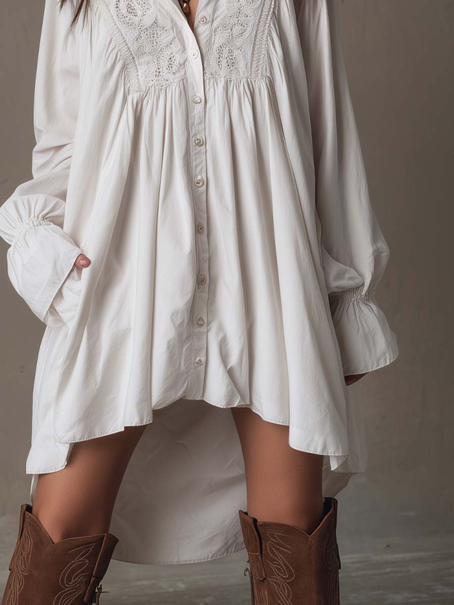 Fashionable women's irregular hem mini dress with long sleeves, a retro design. Perfect versatile white dress for autumn.
