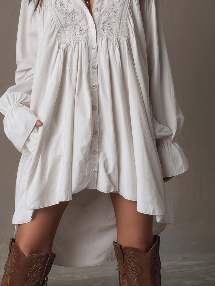Fashionable women's irregular hem mini dress with long sleeves, a retro design. Perfect versatile white dress for autumn.