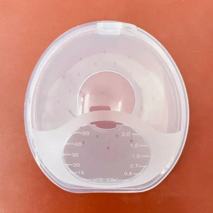 Close-up of a soft, reusable silica gel breastmilk collector, BPA free