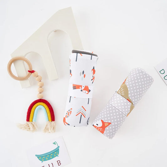 Reusable waterproof baby changing mat with bamboo charcoal, portable & eco-friendly for diaper changes.