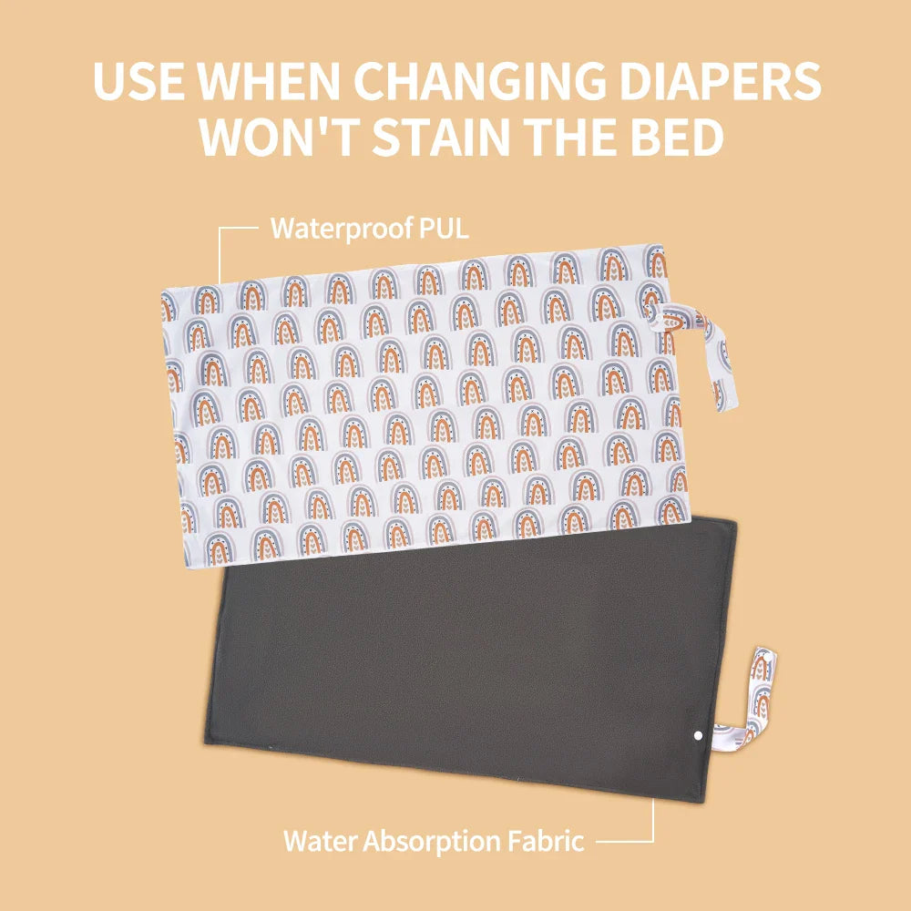 Foldable baby changing mat made of bamboo charcoal, designed for easy travel and hygiene.