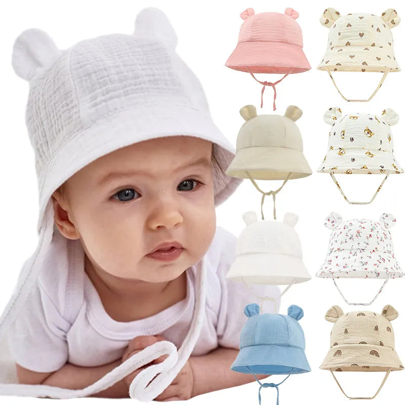 Reversible cotton baby bucket hat with sun protection, unisex, flower print on one side.