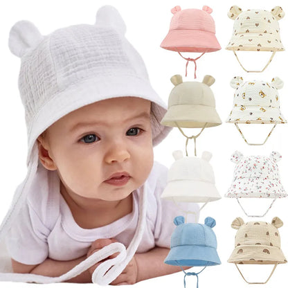 Reversible cotton baby bucket hat with sun protection, unisex, flower print on one side.
