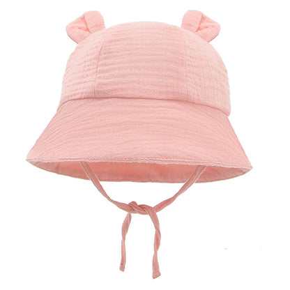 Sun protection baby hat, reversible cotton bucket style with versatile white tiger print.