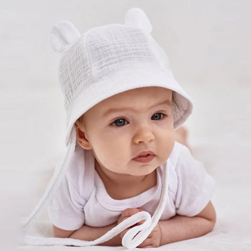 Unisex baby sun hat, reversible cotton bucket, ideal for beach or outdoor play.