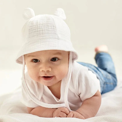 Cotton bucket hat for baby, reversible with flower and white tiger options, sun protective.