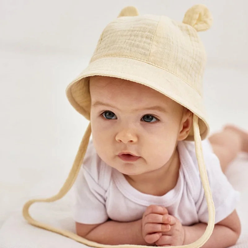 Adjustable baby bucket hat, 100% cotton, white tiger print for sun protection, reversible.