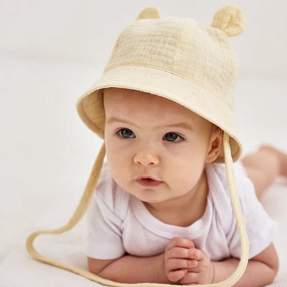Adjustable baby bucket hat, 100% cotton, white tiger print for sun protection, reversible.