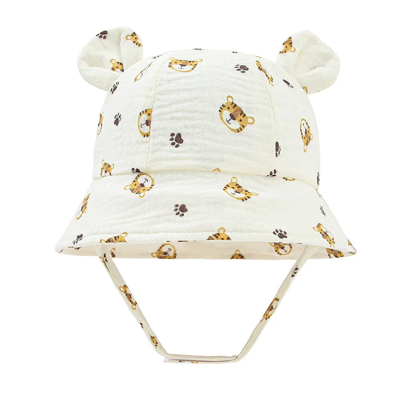 Baby reversible cotton bucket hat, white tiger print, essential for sun protection in summer.