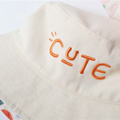 Two sides of a reversible cotton baby sun hat, offering stylish options for summer accessories