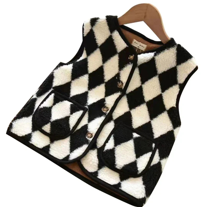 Toddler's reversible puffer vest, a versatile and warm piece of children's fall apparel.