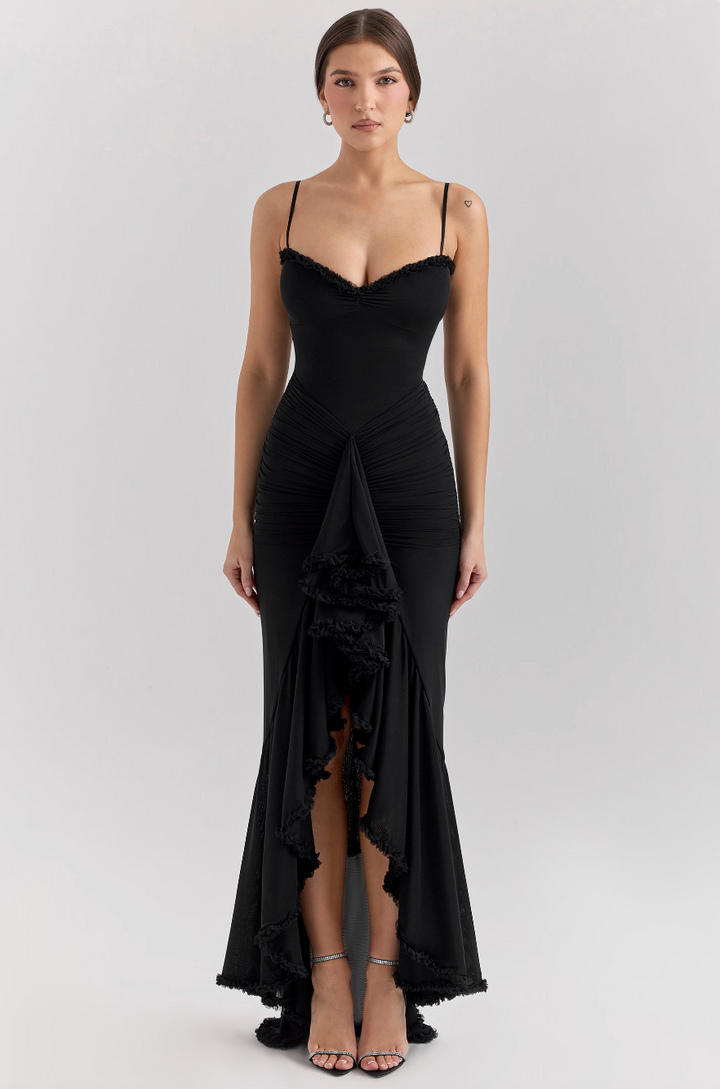Chic women's formal dress featuring romantic ruffles. An elegant, flowy gown for evening occasions.