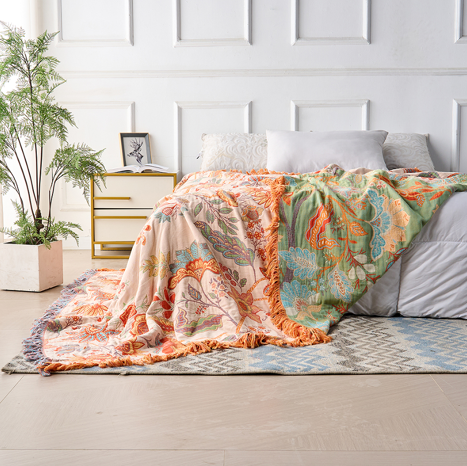 Decorative cotton throw blanket with floral boho pattern, ideal for cozy rustic home decor.