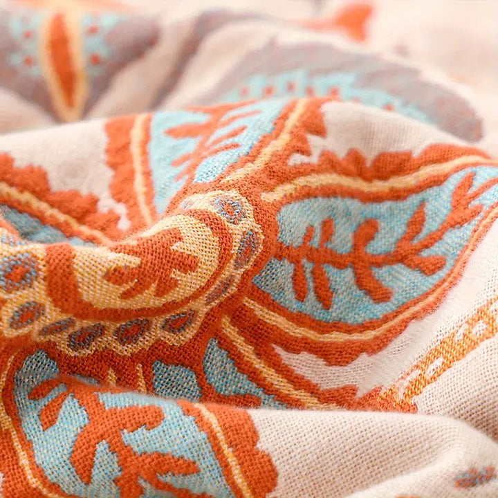 Plush, soft cotton blanket featuring a rustic floral boho design. Enhances any home decor.