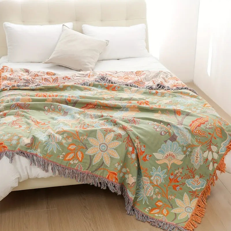 Rustic floral bohemian cotton throw blanket. Soft, machine washable & stylish home decor piece.