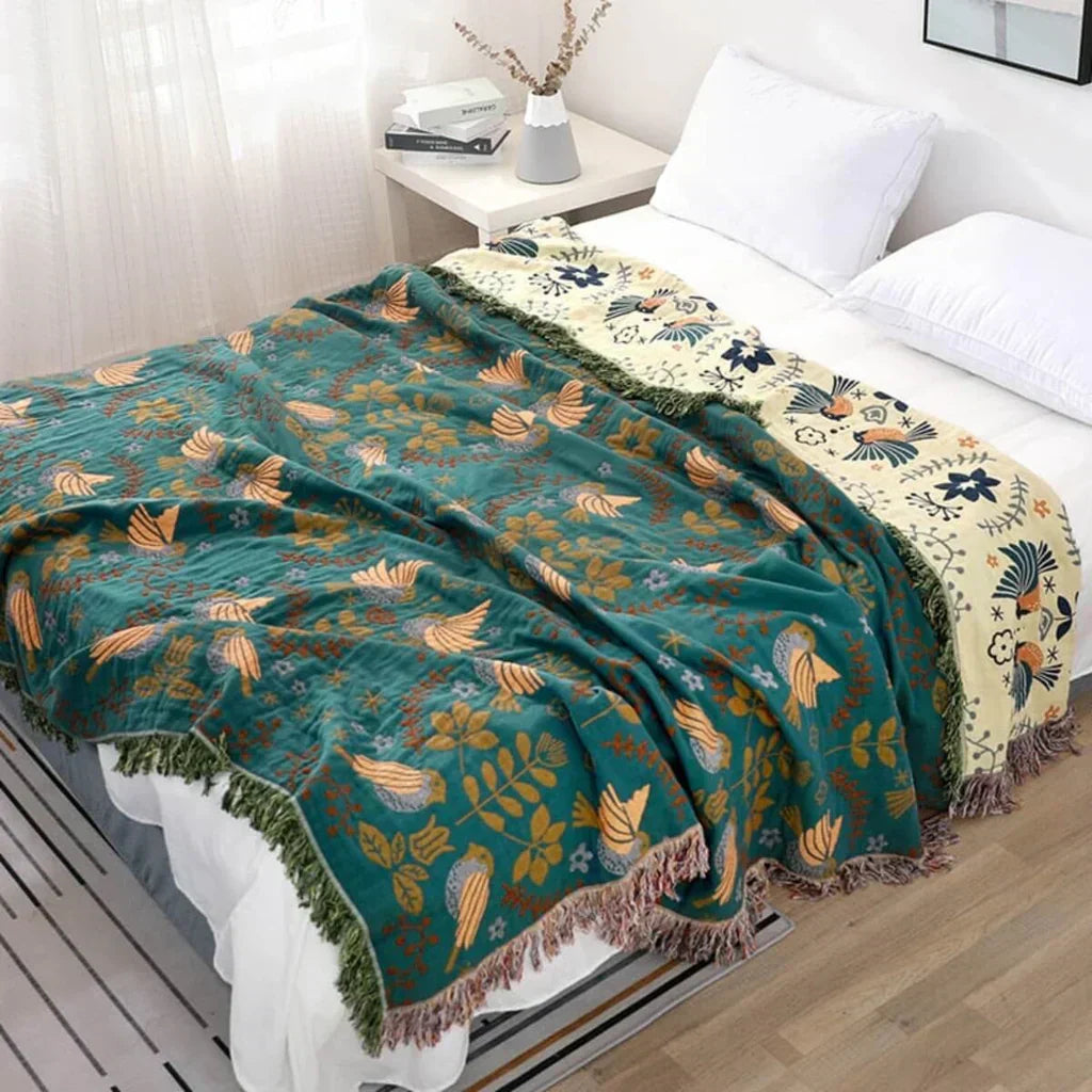 Scandinavian Bird Reversible Throw Blanket, soft cotton textile for home decor.