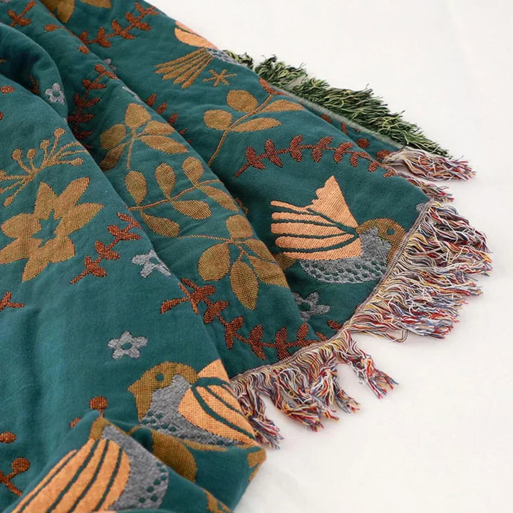 Machine washable cotton throw blanket with a charming Scandinavian bird pattern, reversible design.