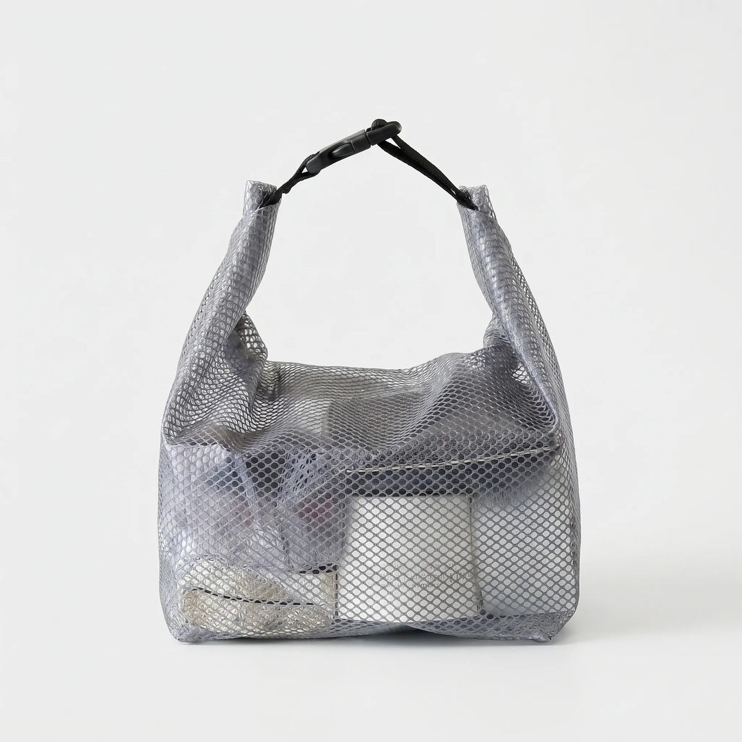 Effortless semi-transparent toiletry bag for travel. Water-resistant and clear design for easy content visibility.