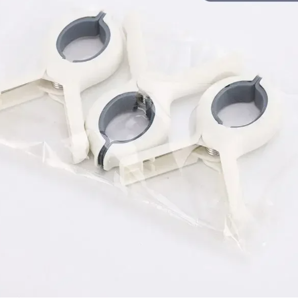 Set of 3 colorful baby stroller clips securing a blanket, ideal for pram, car seat, or travel safety