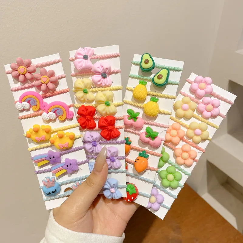 Collection of 50 durable elastic hair bands with cute cartoon accents for baby accessories