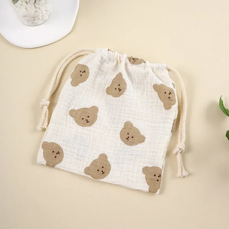 Eco-conscious cotton baby accessory pouch, ideal for travel and nursery organization.