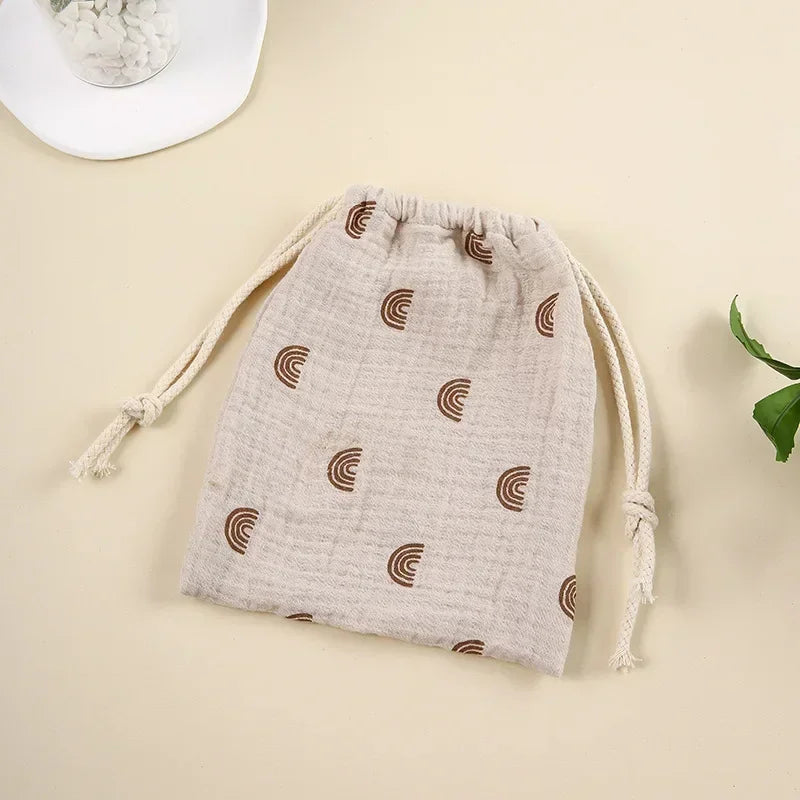 Patterned natural cotton drawstring bag, perfect for storing diapers and wipes.