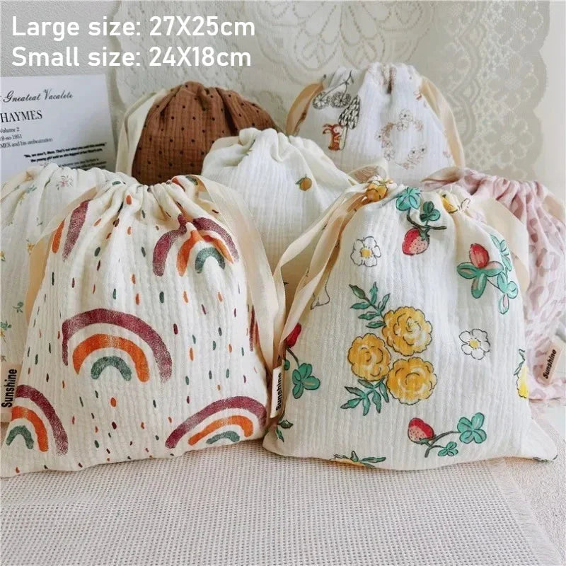 Patterned cotton baby storage bag, ideal diaper bag & travel organizer for nursery essentials.
