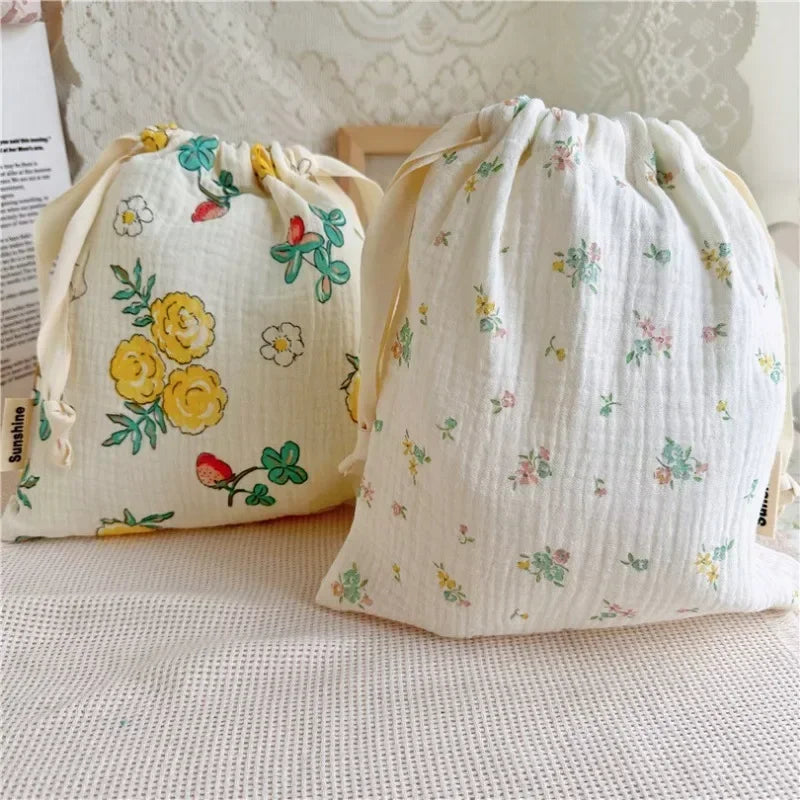 Close-up of soft cotton baby storage pouch with cute pattern, convenient for travel.