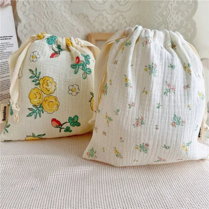 Close-up of soft cotton baby storage pouch with cute pattern, convenient for travel.