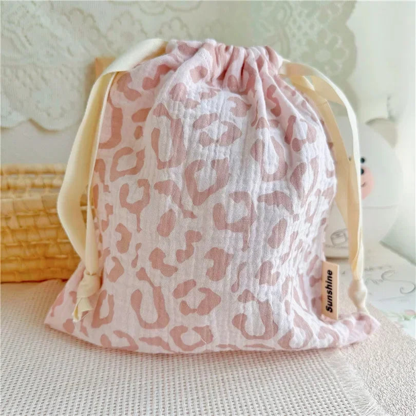 Stylish patterned cotton nursery storage bag, practical for baby accessories organization.