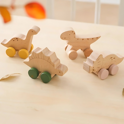 Set of wooden dinosaur roller cars for kids, promoting motor skills and imaginative play.