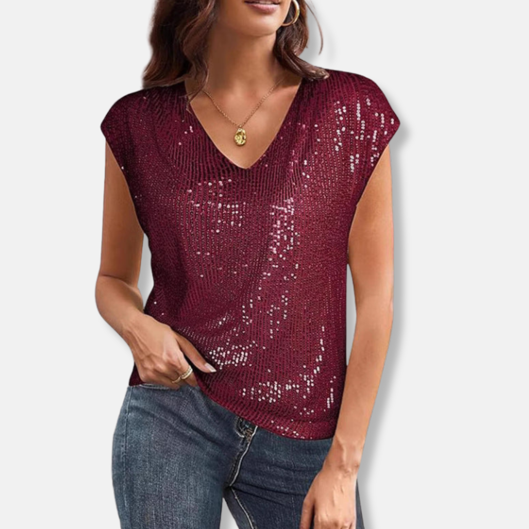 Close-up: Women's shimmering V-neck sequin party top, showcasing detailed sequins & elegant design for evening.