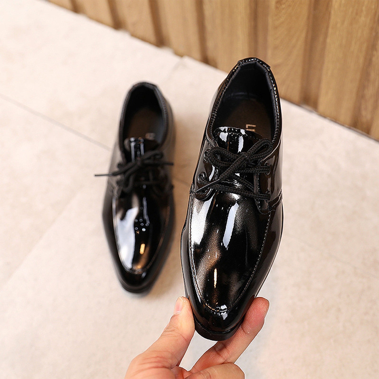 Durable children's black leather slip-on dress shoes, pointy toe for a sophisticated look