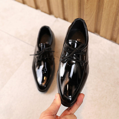 Durable children's black leather slip-on dress shoes, pointy toe for a sophisticated look