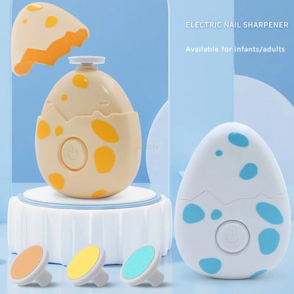 Close-up of a safe electric baby nail file with cute dinosaur egg shape, newborn essential