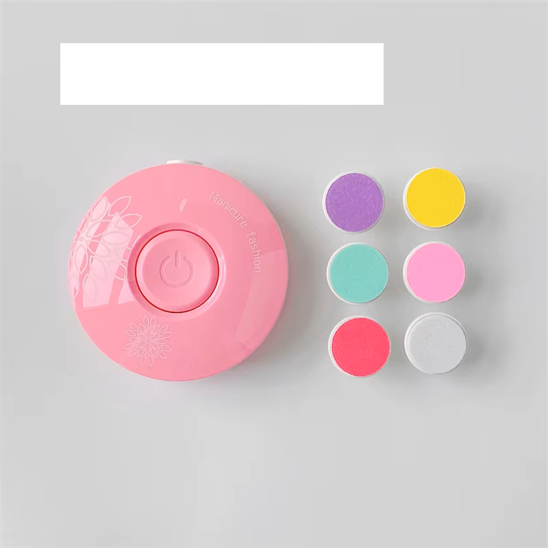 Close-up of the power button on the silent dinosaur egg electric baby nail file