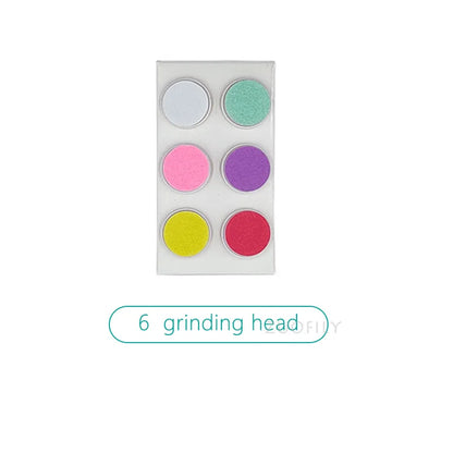 Detail shot of the grinding head on a silent electric baby nail trimmer, dinosaur egg cover