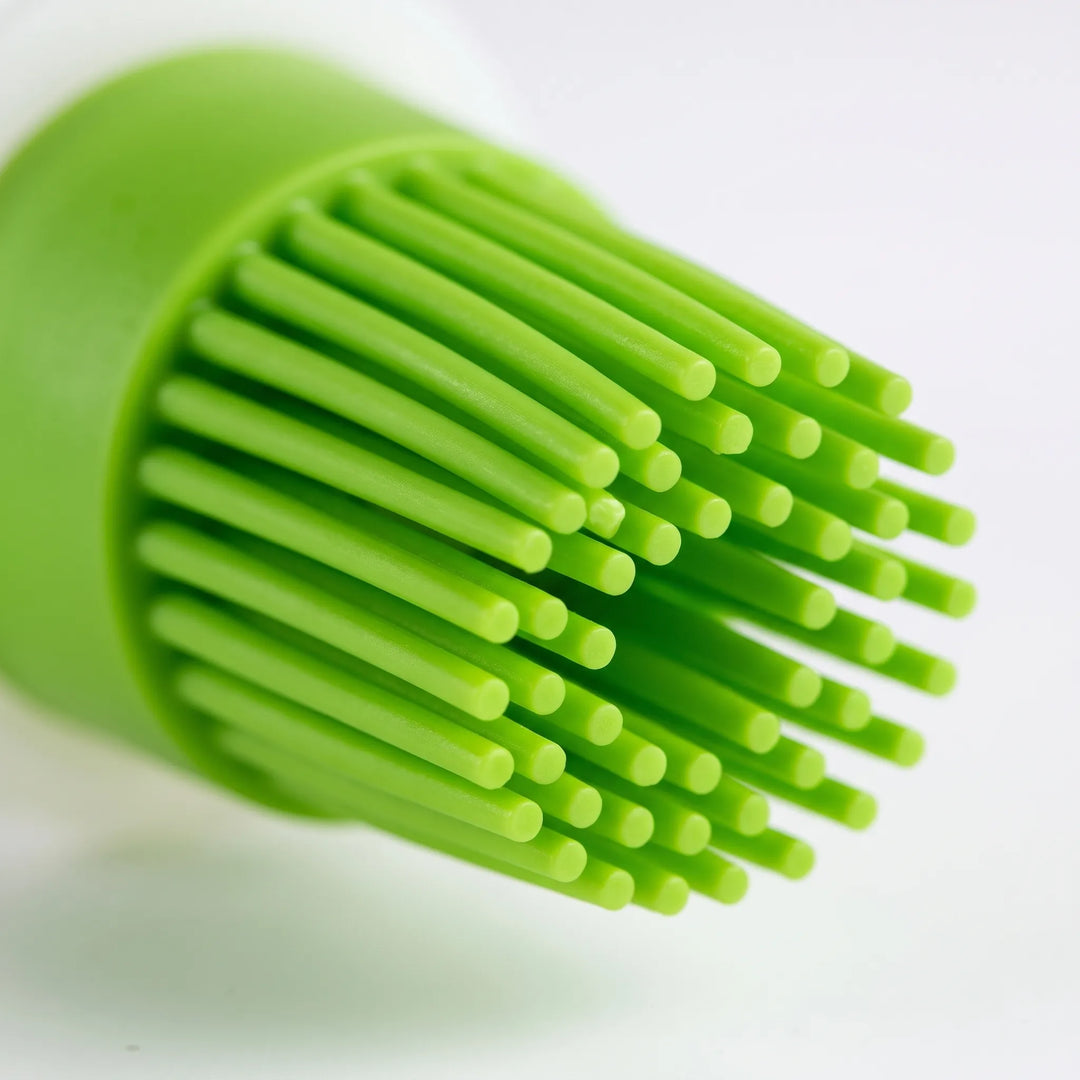 Convenient silicone dispensing oil brush for kitchen. Use as pastry, basting or marinade brush for grilling & baking.