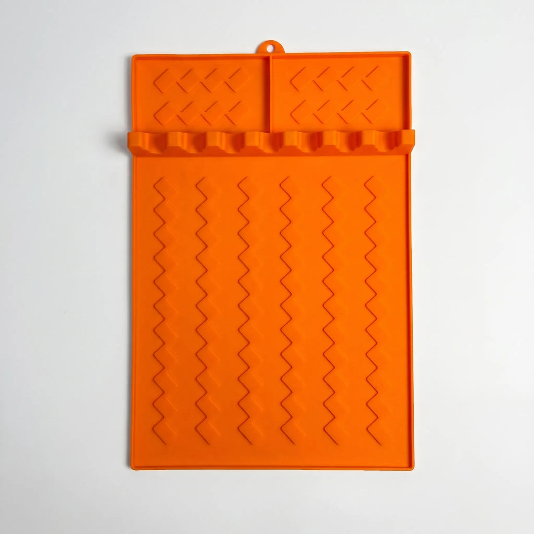 Versatile silicone cooking tool rest for BBQ accessories & kitchen utensils. Ideal spoon rest & drip mat.